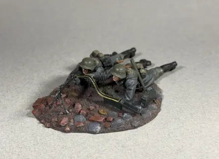 Model of soldiers  on a textured base against a plain background