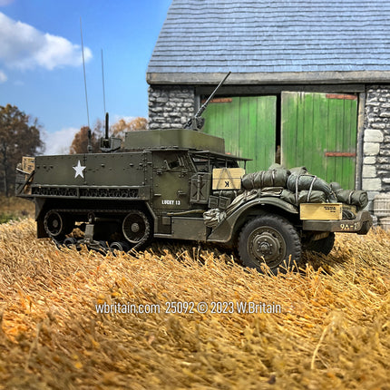 Collectible toy soldier vehicle M3A1 Half-track 9th Armored 27th Infantry. In a field