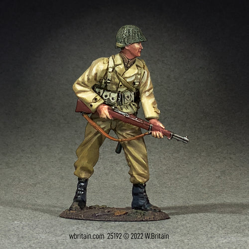 Toy soldier army man U.S. Armored Infantryman with M1 Garand, Alert.