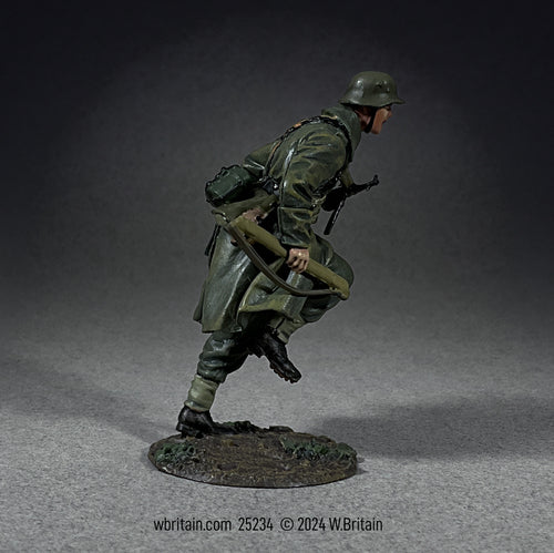 Collectible toy soldier miniature army men German Grenadier Running in Greatcoat With Spare MG 42 Barrel.
