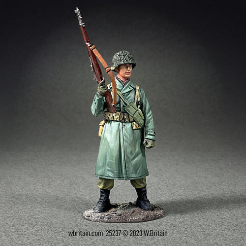 Collectible toy soldier miniature army man U.S. Infantry Standing in Raincoat.