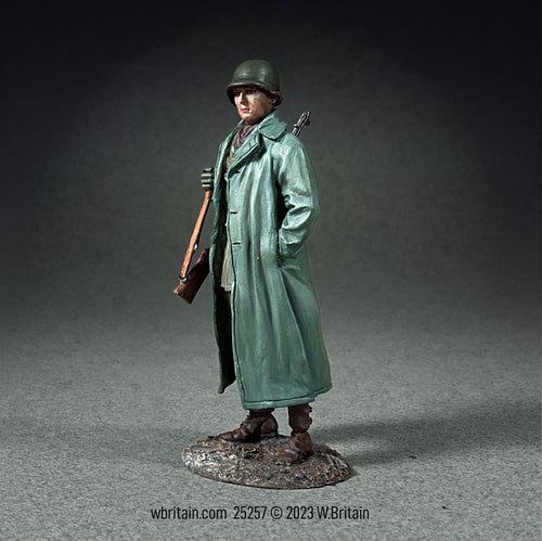 Collectible toy soldier miniature army man U.S. Infantryman Standing with Raincoat over Equipment.  