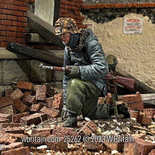 Collectible toy soldier army men German Waffen SS in Kharkov Parka. He is on the battlefield.