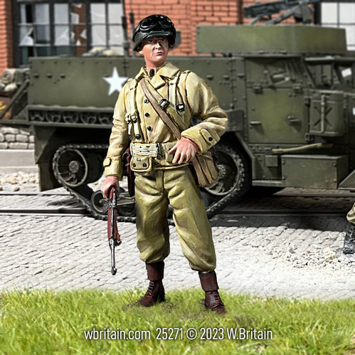 Collectible toy soldier miniature U.S. Armored Infantry Company Officer with M1 Carbine. He is in front of a half track.