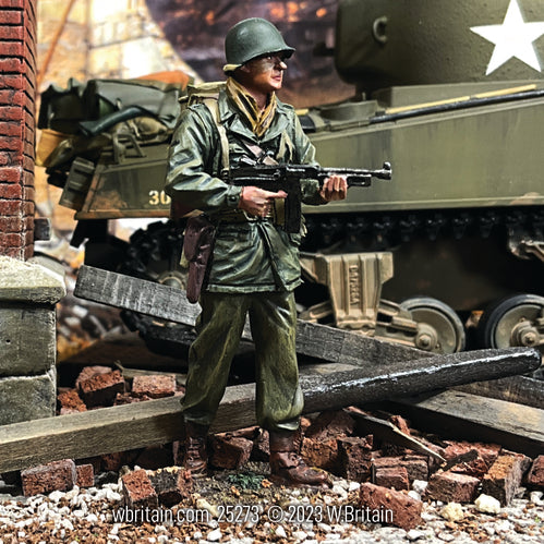 Collectible toy soldier army men U.S. Infantry NCO with Thompson. He is standing in front of a tank.