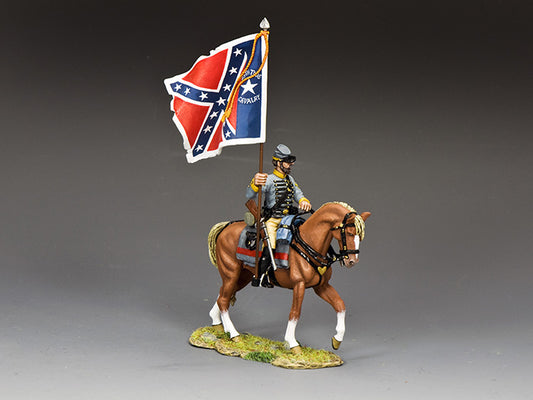 A toy soldier figurine in a Confederate uniform rides a brown horse and holds a Confederate battle flag; the figure is posed on a small grassy base against a plain background.