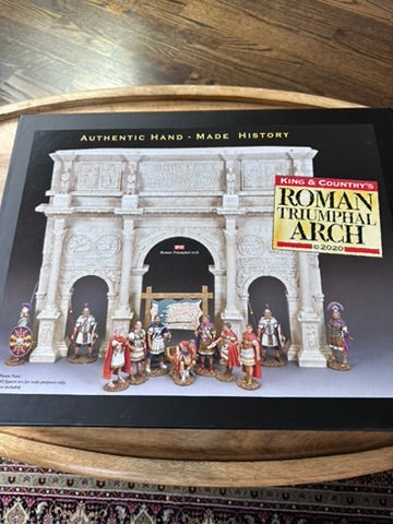 Model of a Roman Triumphal Arch with figures on a display box labeled 'King & Country'.