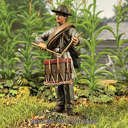 Collectible toy soldier miniature army men Confederate Drummer in Frock Coat. He is in acorn field.