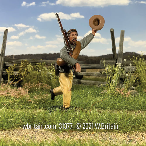 Toy soldier miniature army men Confederate Infantry Marching and Cheering. In a field.