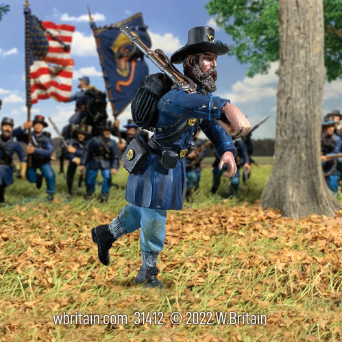 Collectible toy soldier Union Iron Brigade Advancing at Right Shoulder No.3 in a field.
