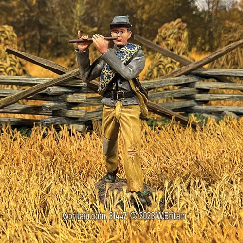 Collectible toy soldier miniature Confederate Infantry Fifer Marching. He is on the battlefield.