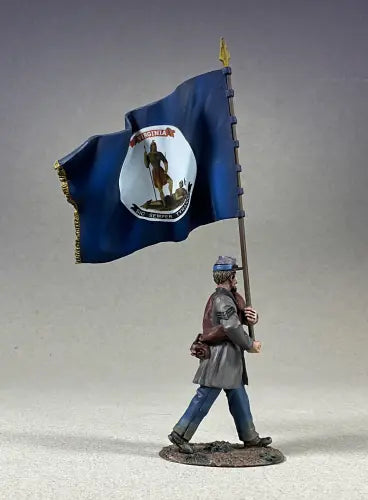 A miniature figurine of a soldier holding a large Virginia state flag on a flagpole, wearing historical military attire.