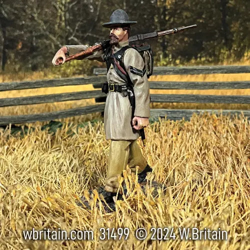 Collectible toy soldier miniature army men confederate soldier in a field.