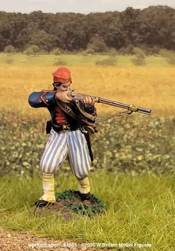 W. Britain Louisiana Tiger Confederate Zouave firing musket — red fez, blue jacket, blue-and-white striped trousers. 1/30 scale matte-painted, 1861-62. Catalog 31505.