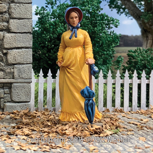 Collectible toy soldier miniature Miss Samantha Young Woman with Parasol. She is wearing a yellow dress and blue bonnet.