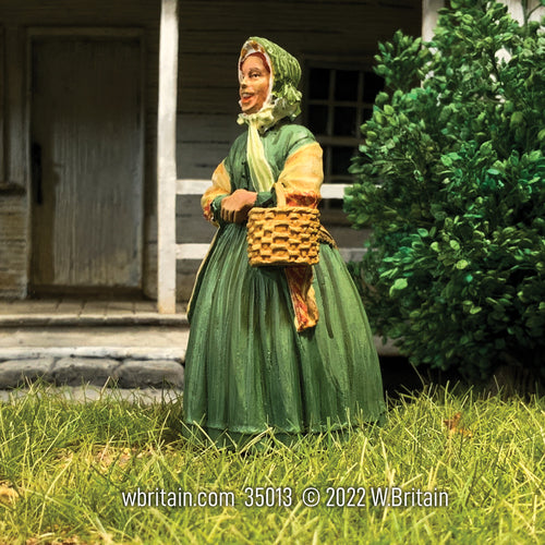 Side view of Collectible civilian miniature Betsy Going to Market, 1860s Woman.