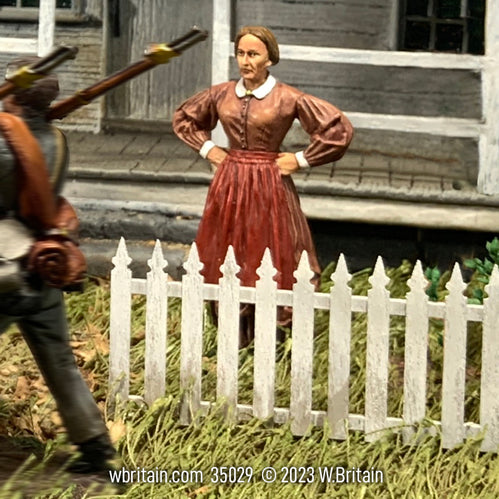 Civilian miniature figurine Mrs. Johnson. Standing in her front yard.