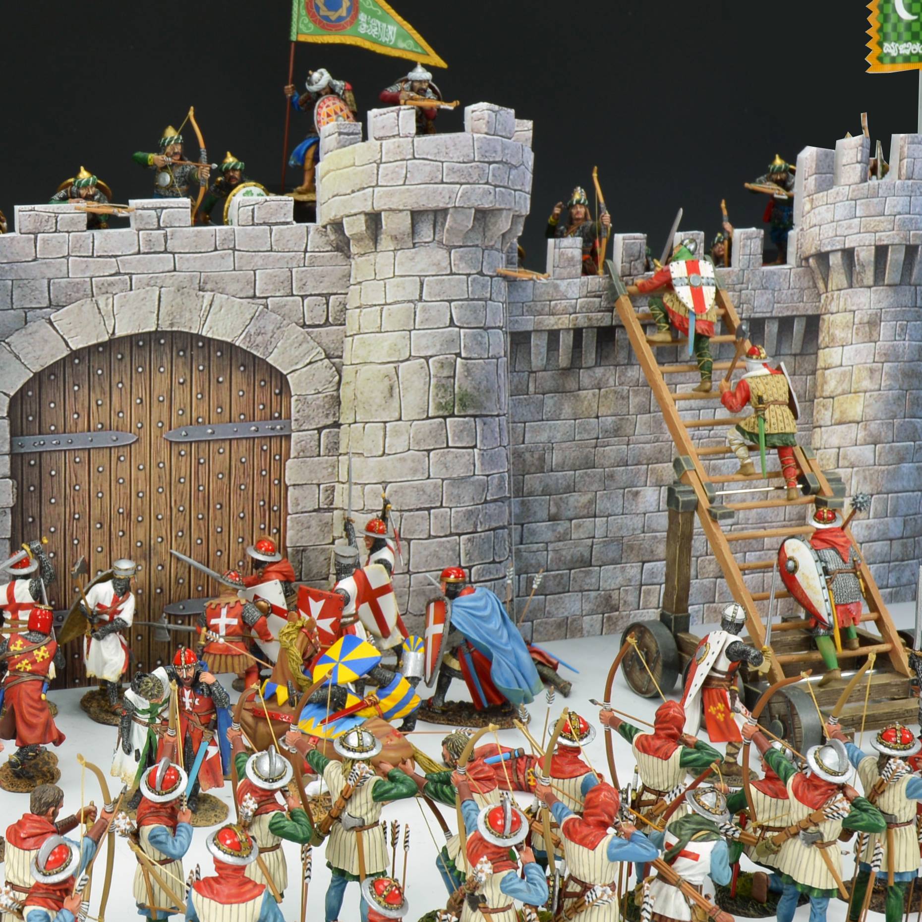 Model of a medieval castle with soldiers and flags