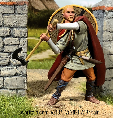 Collectible toy soldier miniature "Torgny" Viking Attacking with Axe. He has a red cloak.