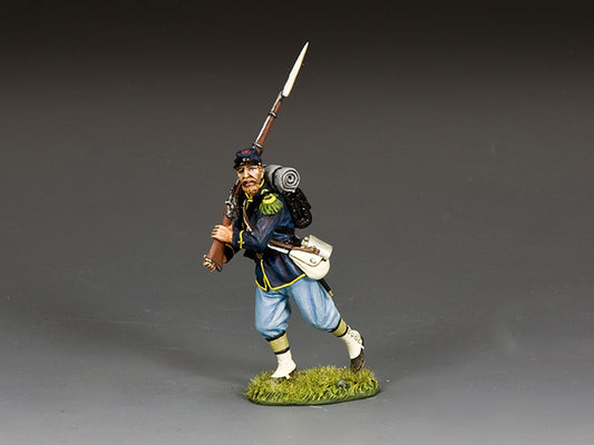 Union infantryman toy soldier in dark blue coat advances with rifle and bayonet ready, gripping weapon with both hands mid-charge.