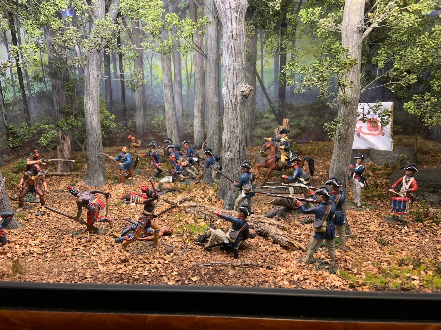 Revolution toy soldier diorama scene in the woods.