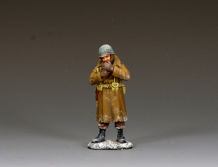 WWII U.S. GI in winter coat warming his hands and smoking, 1/30 scale matte figure.