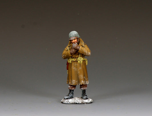 WWII U.S. GI in winter coat warming his hands and smoking, 1/30 scale matte figure.