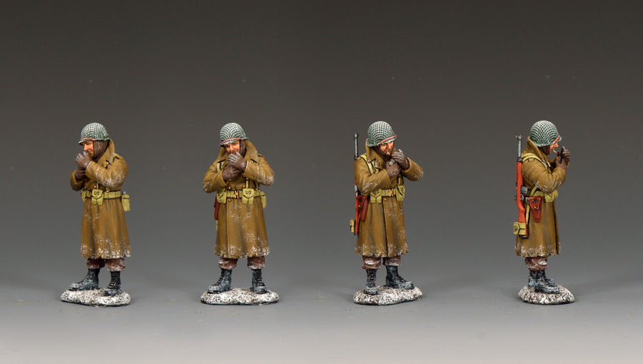 Panoramic view of WWII U.S. GI in winter coat warming his hands and smoking, 1/30 scale matte figure.