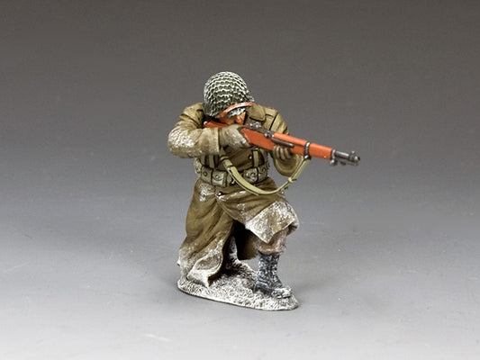 Kneeling U.S. infantryman in winter gear takes aim with M1 Garand during the Battle of the Bulge, 1/30 scale matte finish.