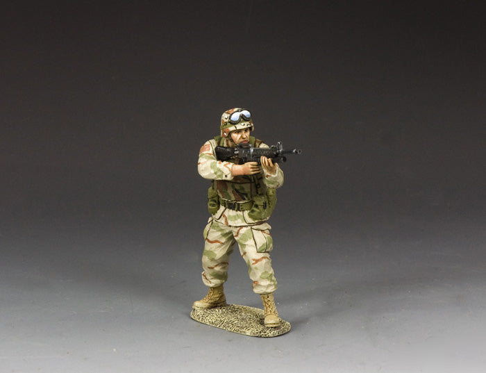 Toy Soldier U.S. Army Ranger aiming M16A2 with M203 grenade launcher in desert camo, mid-action.