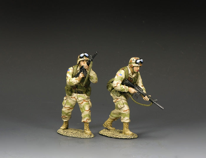 Two U.S. Army Ranger toy soldiers in desert camo advancing under fire, one aiming and the other moving forward
