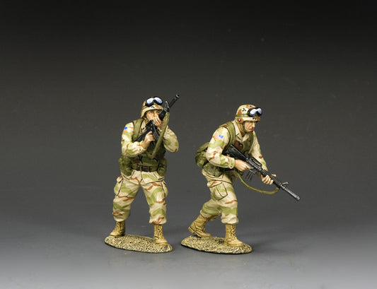 Two U.S. Army Ranger toy soldiers in desert camo advancing under fire, one aiming and the other moving forward