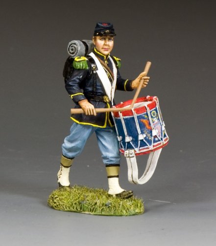 Toy soldier figure of a drummer boy holding a drum on a gray background