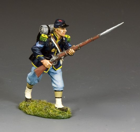 Military miniature Union corporal charges forward with fixed bayonet, wearing full kit and the distinctive blue uniform of the 83rd Pennsylvania Infantry.