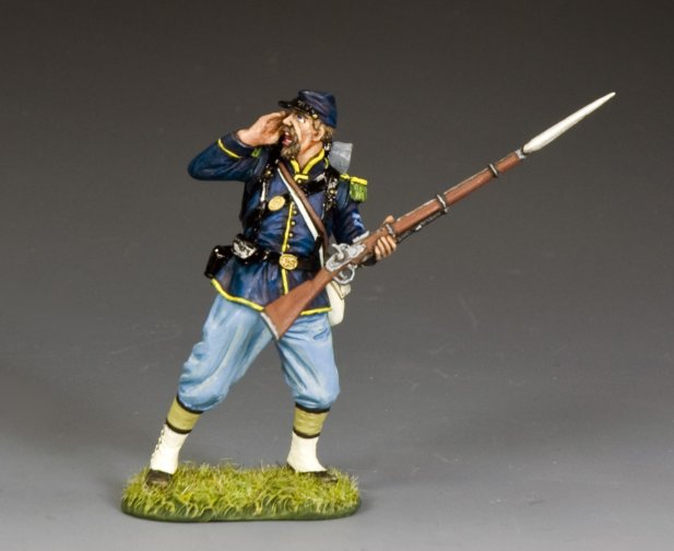 Model of a toy soldier in historical uniform with a rifle on a gray background