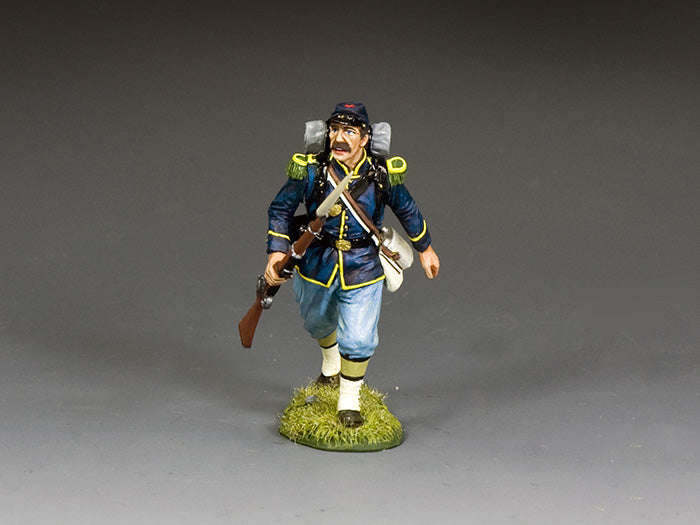 Union toy soldier military miniature at a run with rifle at the trail, eyes fixed ahead in a battlefield charge.