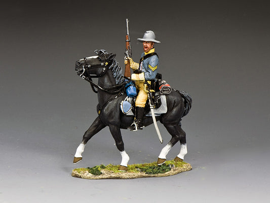 Toy soldier of a Confederate cavalry corporal on a black horse, holding a carbine while moving into firing position.