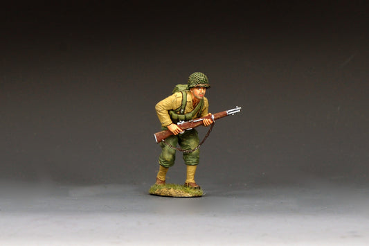 King & Country DD400 figure of a U.S. Army rifleman advancing at a crouch with an M1 Garand held ready, net-covered helmet and field pack.