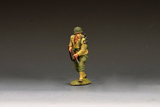 King & Country DD404 figure of a U.S. Army scout advancing warily at the front with an M1 Garand held low, net-covered helmet, pack and Indian Head patch.
