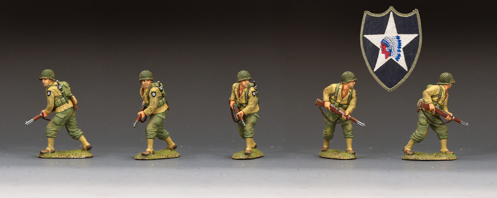 DD404 hand-painted miniature military figurines of soldiers in olive green uniforms with rifles, arranged in a row against a dark gray gradient background. A black shield emblem with a white star and red/blue details is shown in the upper right corner.