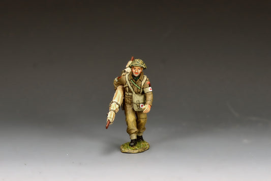 King & Country Gold Beach Medic with Stretcher, RAMC corporal in MkII helmet with scrim and Red Cross brassard, folded stretcher over shoulder, D-Day Normandy 1944, 1/30 60mm matte figure, DD416