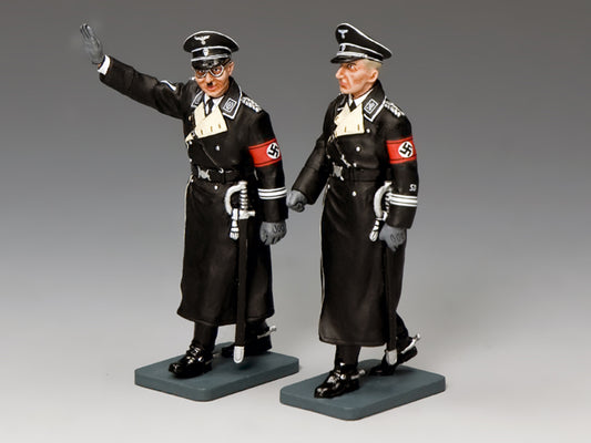Two model figures in Nazi uniform on gray bases against a gray background