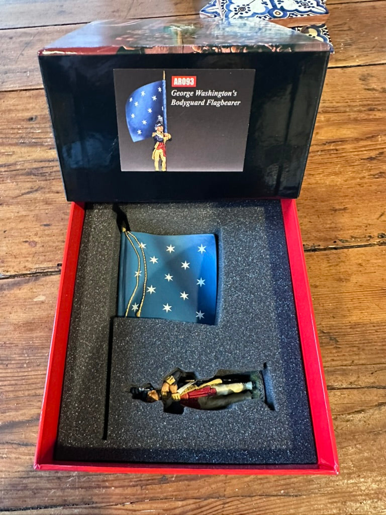 Model of George Washington's Bodyguard Flagbearer in a display box on a wooden surface