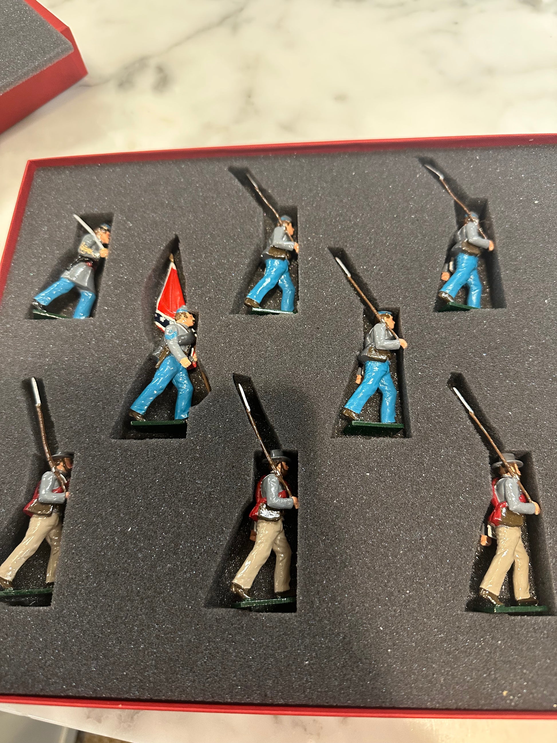 Toy soldier set confederate marching with flag packed in classical tradition red box.