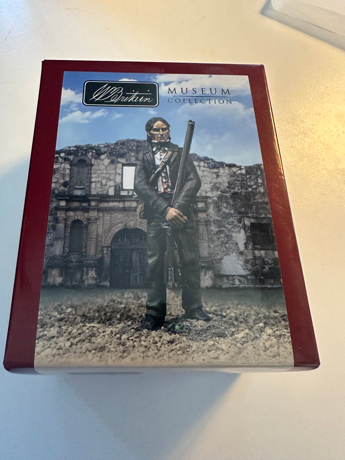 Box cover for Collectible toy soldier miniature army men David Crockett at the Alamo in brown jacket.