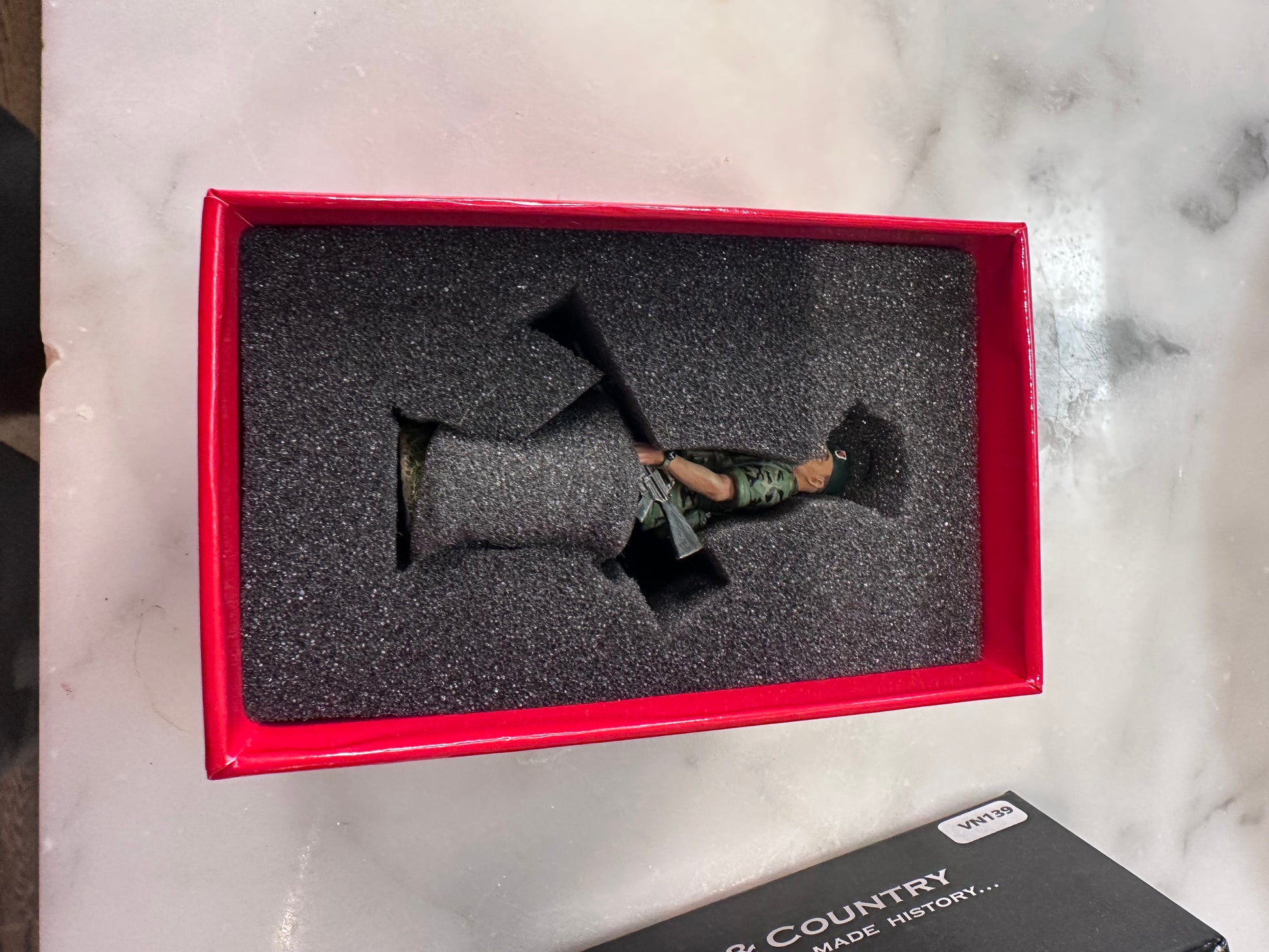 In side the box for toy soldier green beret.