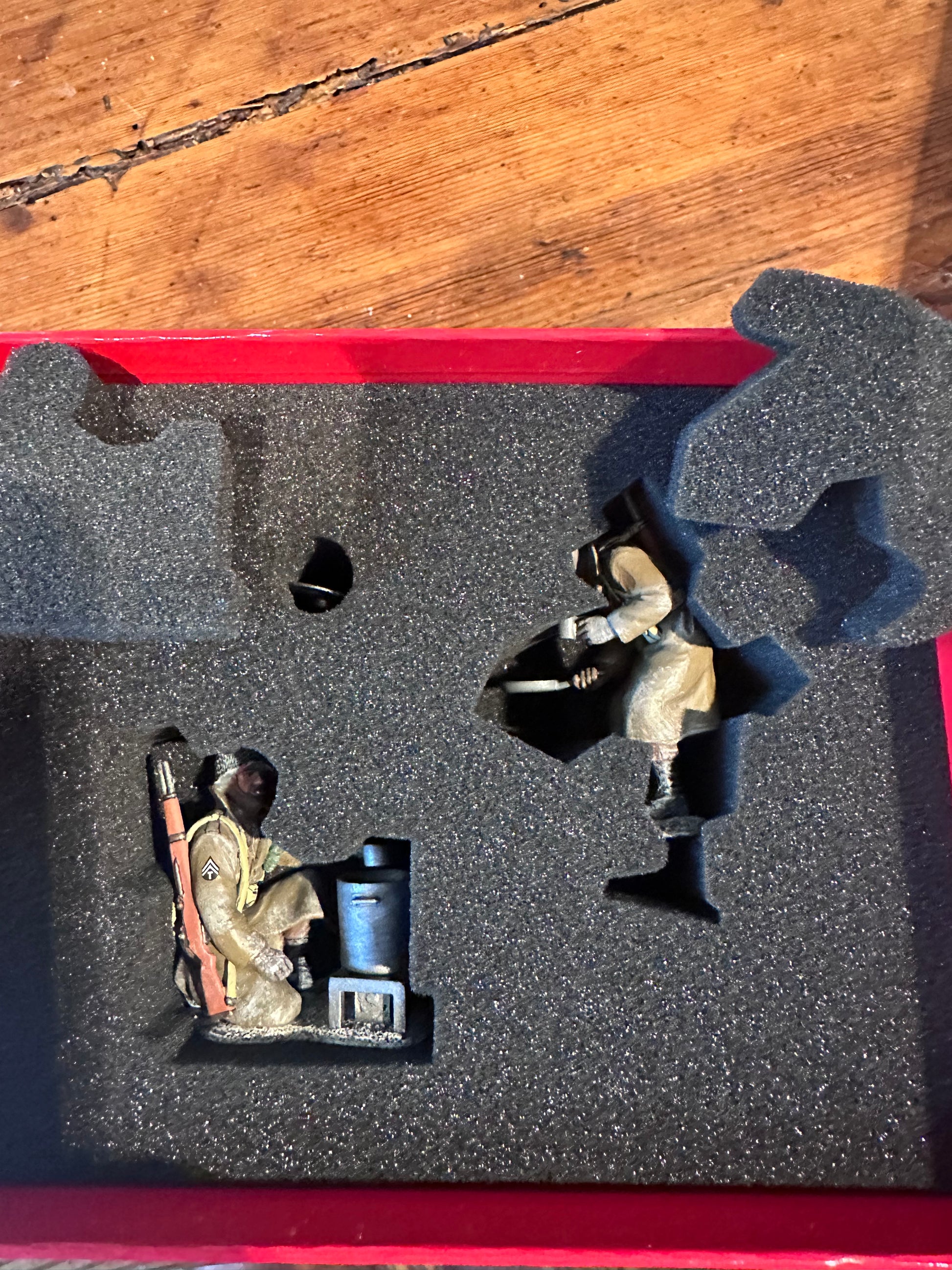 Toy Soldier figurine toy on a red and black foam tray.