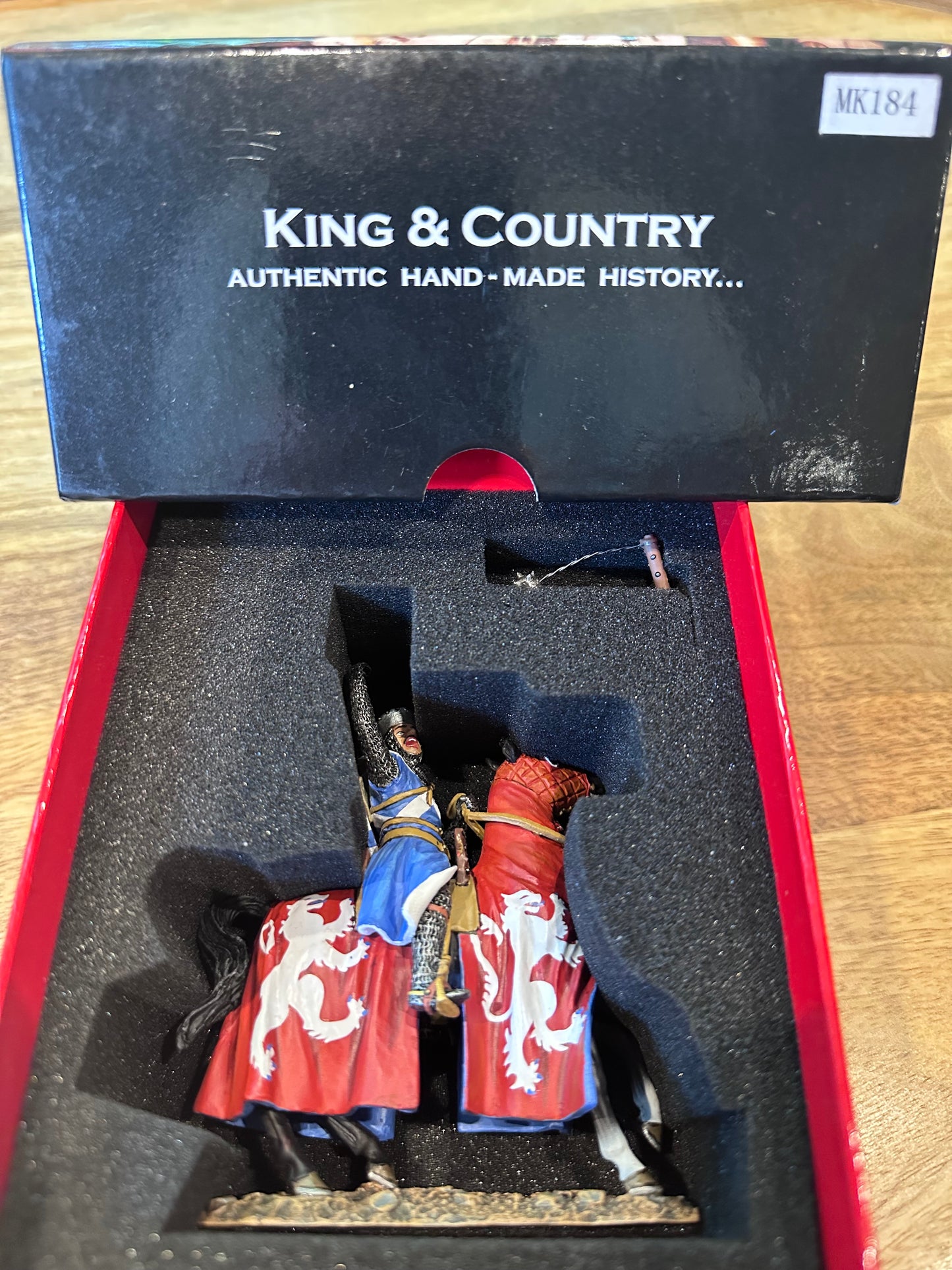 Toy Soldier Model figure Sir William Wallace in a display case with 'King & Country' branding on a wooden surface.