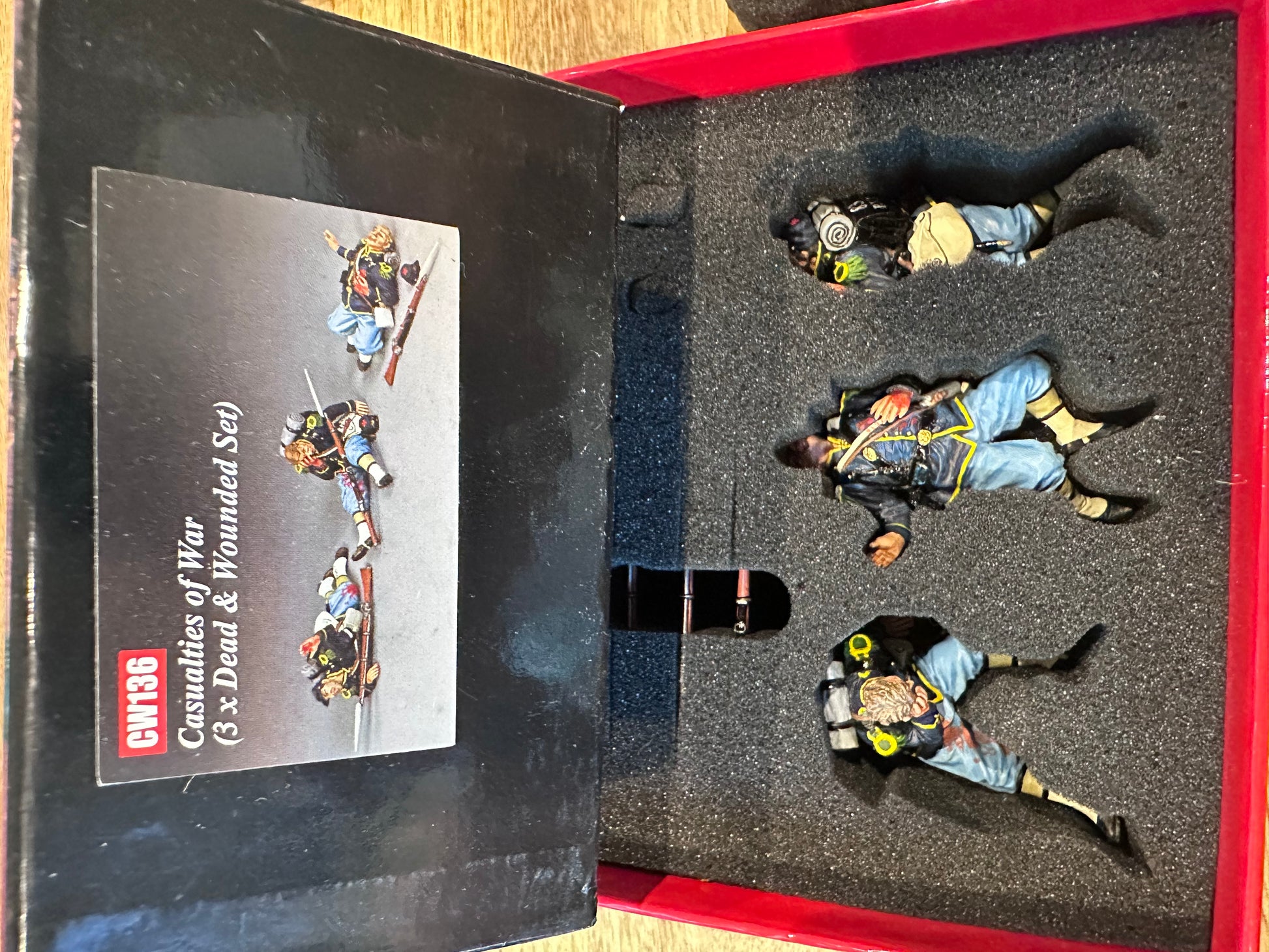 Casualties of War presented in a classic red collector's box.