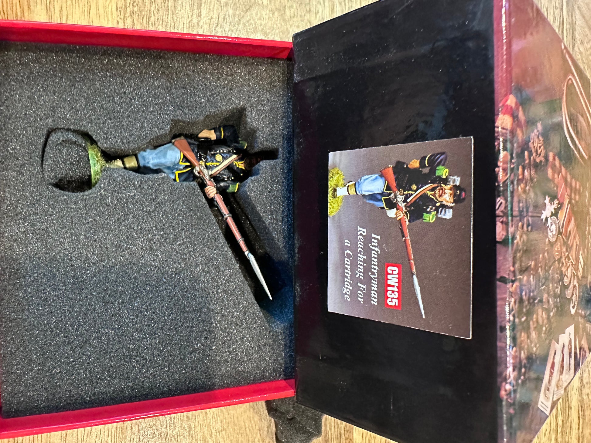 Infantry Reaching for a Cartridge presented in a classic red collector's box.